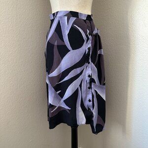The Kit Short Skirt Side Zip Closure Ruffles Front Buttons Asymmetrical Hem Purp
